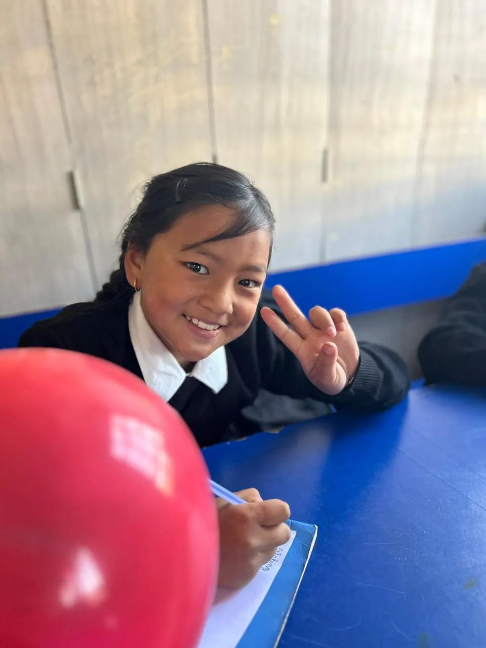 A student participating in a Mission SOAR school activity in Jotsoma